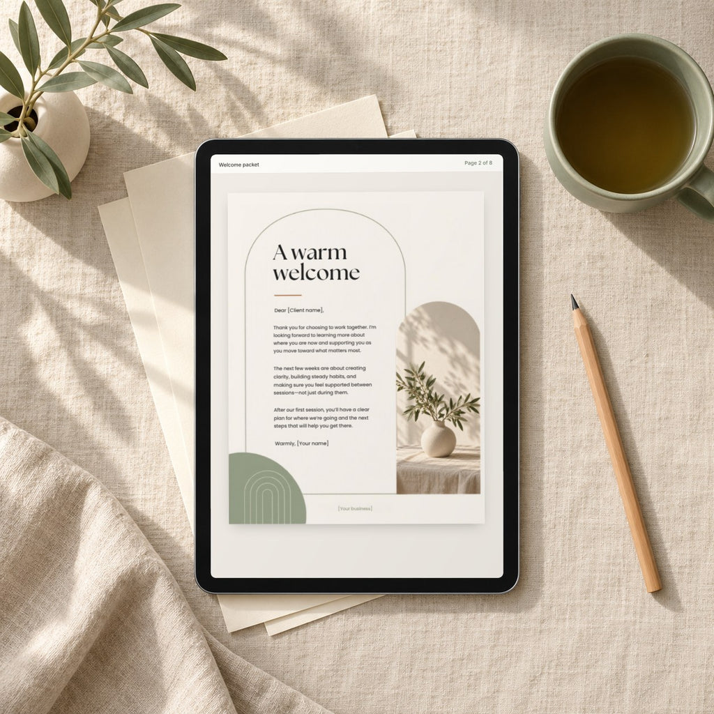 Client Welcome Kit welcome packet page open on a tablet on a linen tablecloth