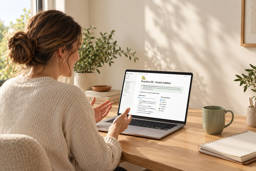 A coach at her desk with the Practice OS Coach edition open on her laptop
